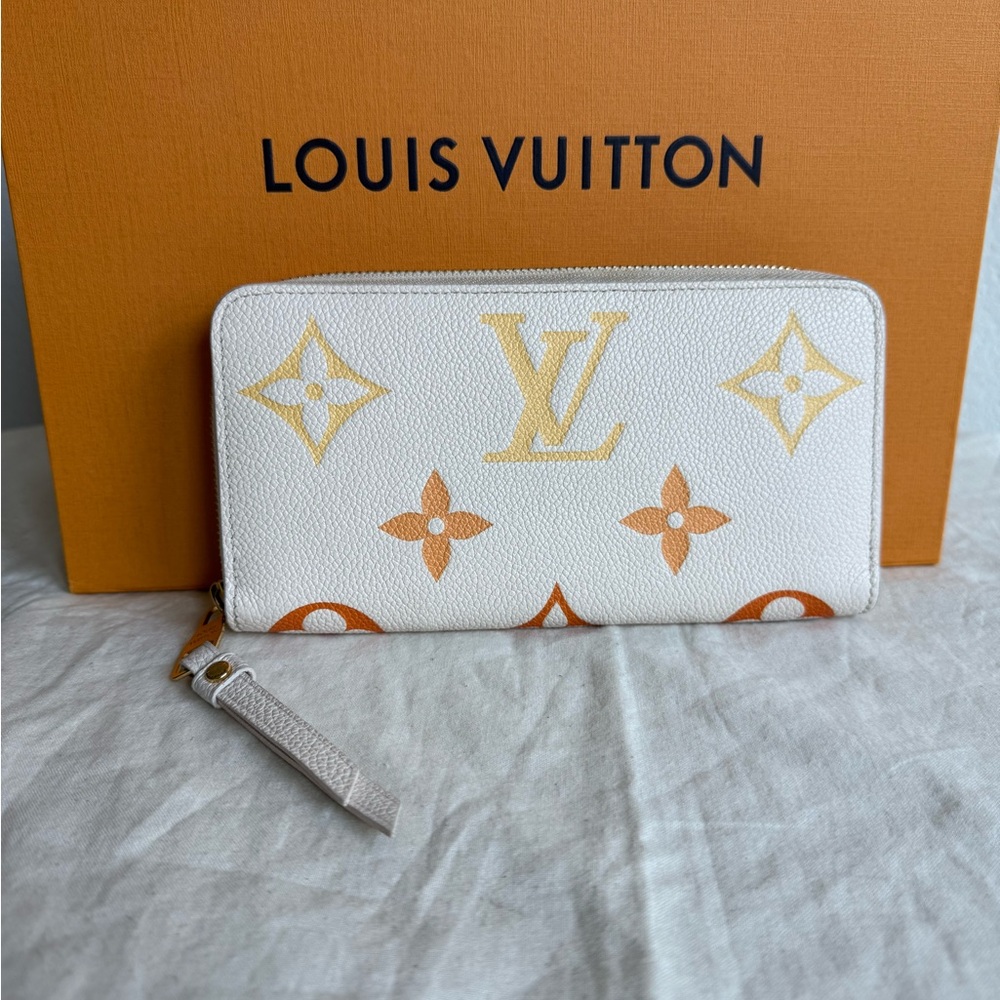 LOUIS VUITTON Empreinte Monogram Giant By The Pool Zippy Wallet Cream Saffron
